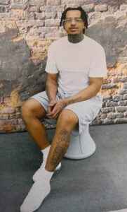 Isaiah Holmes sitting down in prison