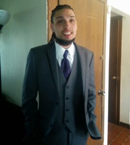 Alberto Sepeda in suit and tie