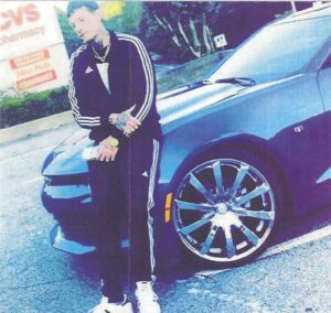 Kristofer Armistead standing by black car