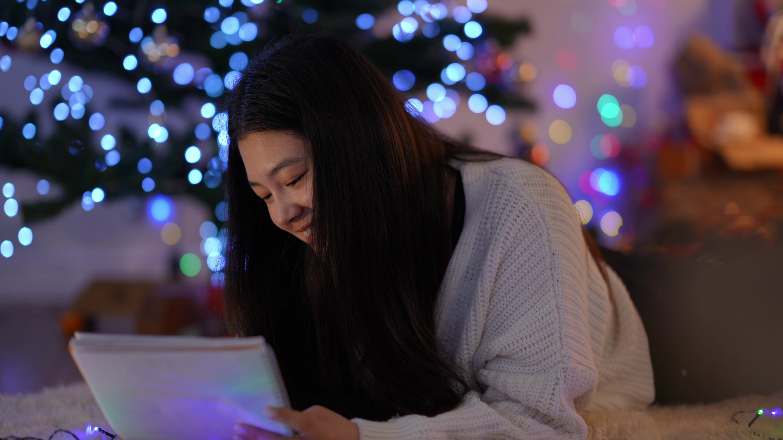 asian woman writing letter to her pen pal