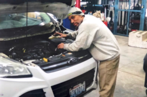 Oscar Taggart working on car