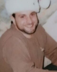 mario mannino wearing hat